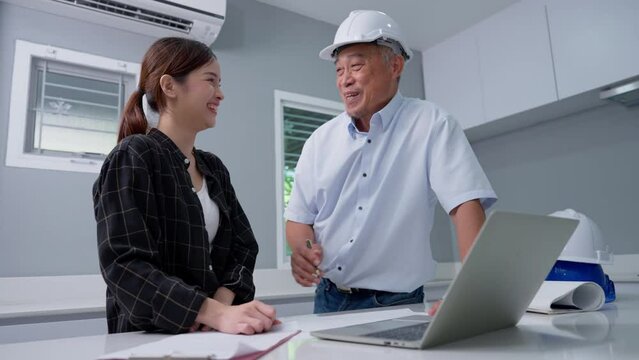 Senior home inspector checking home defects and teaching young engineers, before handing it over to client. Young engineers learn home inspection with Senior, Real estate, and renovation concepts.