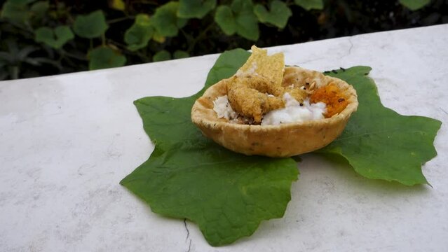 Food placed on a green leaf during a Hindu Ritual in the month of Sharada. Indian Customs and Traditional.