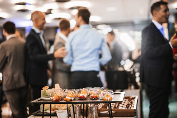 Blurred image of businesspeople at banquet event business meeting event. Business and entrepreneurship events concept. Focused on the canapes. - obrazy, fototapety, plakaty