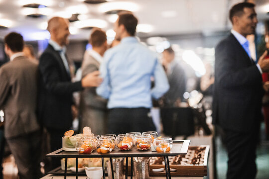 Blurred image of businesspeople at banquet event business meeting event. Business and entrepreneurship events concept. Focused on the canapes.