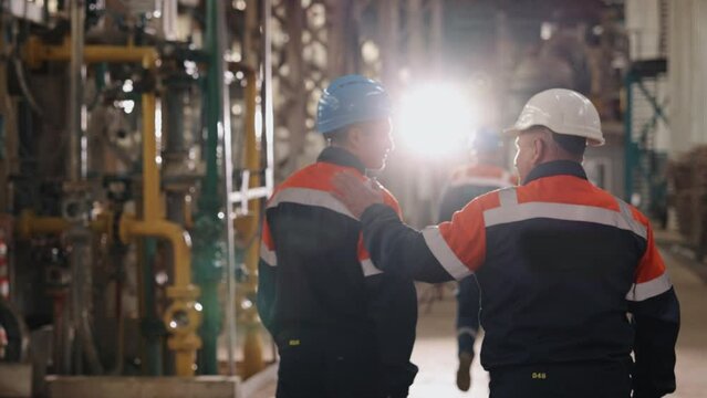 Plant tour, Industrial visit, Equipment check. At the plant, engineers are conducting a walkthrough.