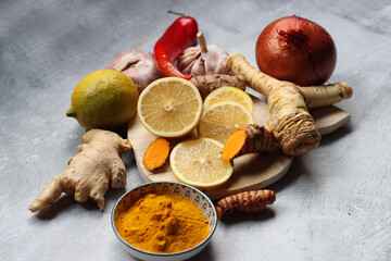 Boosting immune system concept.  Herbal remedy ingredients on a table. Root vegetables, herbs and...