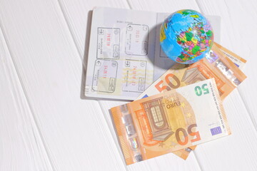 Fototapeta na wymiar Travel concept, passport, globe earth and money on white background