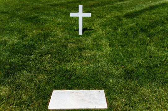 White marble tomb and cross at Arlington National Cemetery, a military cemetery in Washington DC, the capital of the United States of America.
