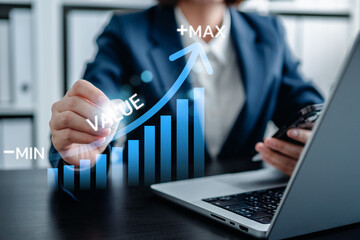 Businesswomen pointing virtual value arrow graph raises for business and profit to benefit growth...