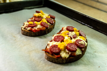 mini pizza with sausage. lecho. food concept.