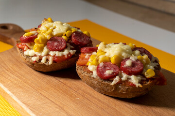 mini pizza with sausage. lecho. food concept.
