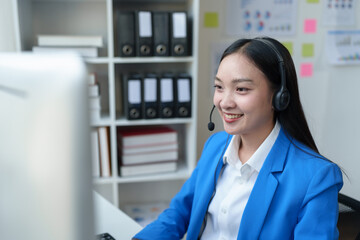 Asian call center girl working to provide customer service through online communication channels, business operator providing customer service online Communicate business information to customers.