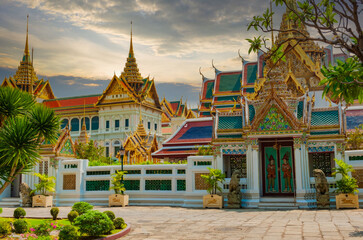 Grand Thai Temple Complex with Golden Spires, Mythical Guardians, and Lush Gardens, Thailand