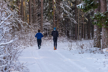 person runing in winter forest