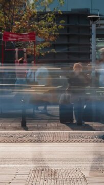 Vertical time-lapse unrecognizable people crowd crossing city street busy crossroad, blurry pedestrians crossing crosswalk intersection on summer day. Rush hour lot of people walk, blurred motion	
