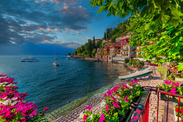 Charming European Lakeside Town with Vibrant Flowers, Serene Waters, and Colorful Architecture