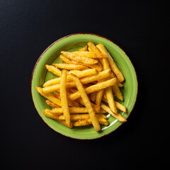 top view plate with chips on dark background