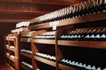 Wine bottles on the shelves in the rack