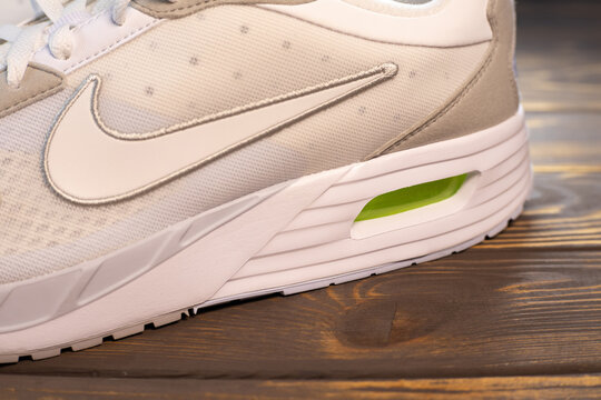 KYIV, UKRAINE - January 09, 2024 :  New Nike NIKE AIR MAX SOLO sport shoe. White Trainers close up.