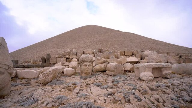 Antique ruined statues on Nemrut mountain in Turkey 4K Ancient stone heads at the top of 2150 meters high Mount Nemrut.
