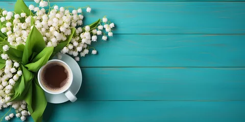 Foto op Canvas Coffee mug with bouquet of flowers lily of the valley and notes good morning on turquoise rustic table from above, beautiful breakfast, vintage card, top view, flat lay © Ziyan Yang