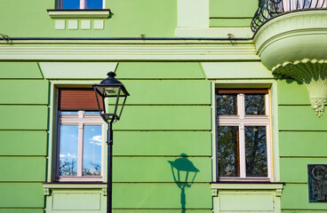 Detail of Mika Alas's house at Kosancicev Venac street, street lamp and the green facade - obrazy, fototapety, plakaty