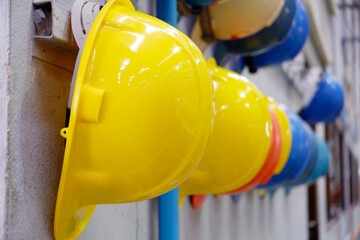 Yellow safety hat and blue safety hat in the factory.