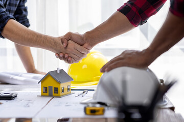 Handshake Real estate brokerage agent Deliver a sample of a model house to the customer, mortgage loan agreement startup plan new project house contract home insurance mortgage loan concept	