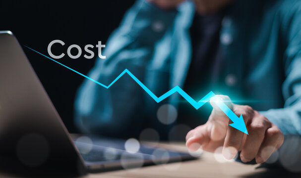 Cost reduction business finance concept. Businessman touch virtual screen of cost reduction icon with down arrow for budget management and cost management.