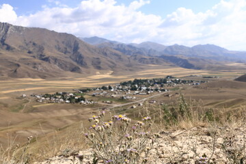 Mountain plateau over small village, road to Kazarman, district of Jalal-Abad Region in western Kyrgyzstan