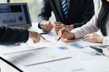 Business people meeting together brainstorming business strategy analysis and investment planning. Financial consultant discuss analysis financial chart and market growth graph for business planning.