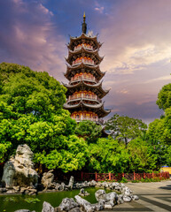 Majestic, MultiTiered Pagoda at Sunrise, Nestled in Lush East Asian Garden