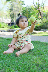 little child playing with a ball