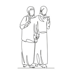Obraz premium two Muslim girls demonstrate a peace sign with their hands
