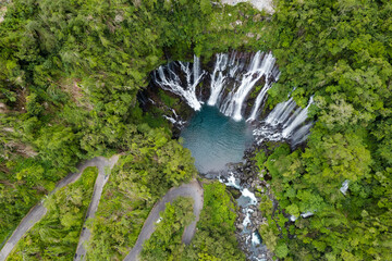 Aerial view on the Cascade Grand Galet and the Langevin basin of La Reunion island - Powered by Adobe