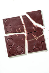 broken bar of chocolate with the inscription 