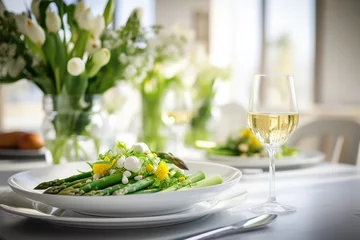 Abwaschbare Fototapete Table setting with food, grilled asparagus salad © pilipphoto
