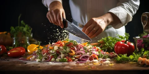 Fotobehang Chef using Knife Cutting Vegetable Salad in a Professional Kitchen © imagemir