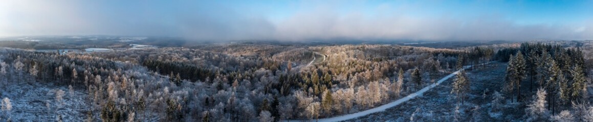 Aerial panoramic shot of lightly snow-covered Taunus in Germany