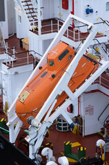 emergency freefall lifeboat at the rear of a cargo ship