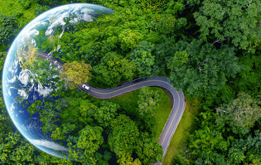 Electric car and EV electrical energy for environment, EV car on forest road with earth planet going through forest, Ecosystem ecology healthy environment, Electric car with nature, Save earth energy.