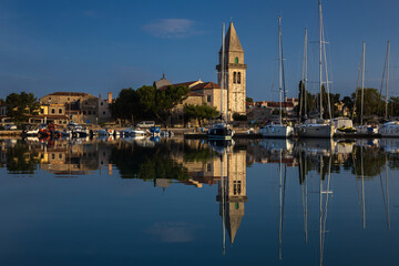 On Board of a Sailboat Waiting for Passage trough the Channel of Osor in Morning Warm Lights View of the Town Waterfront