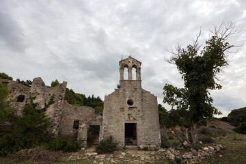 Fototapeta na wymiar Ruins of ancient Monastery of Saint Marry of the Angels on the coast of medieval town Osor, Cres Island Croatia