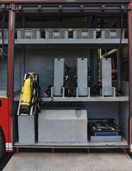 Close-up of essential firefighting equipment on a modern firetruck, showcasing tools and gear ready for emergency response to hazardous fire situations