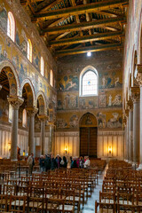 Fototapeta premium tourists enjoy a guided tour of the Monreale Cathedral in Sicily