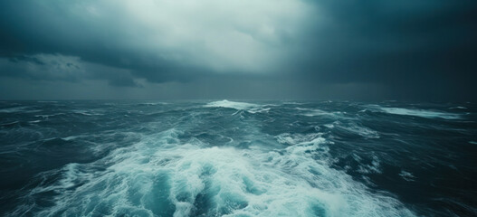 Stormy ocean waves under dark dramatic sky. Nature's power and oceanography.
