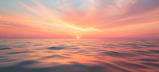 Fototapeta na wymiar Serene ocean sunset with gentle waves and warm colors. Peaceful nature background.