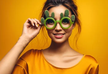 Foto op Plexiglas a woman wearing glasses in the shape of a cactus plant © Meeza