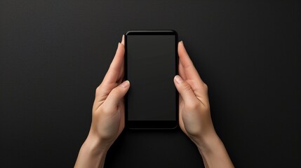 A top-down perspective capturing hands with a mobile mockup against a black background, the high-definition image highlighting the realistic texture and sleekness of the device - obrazy, fototapety, plakaty