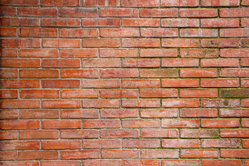 brick wall of red color. Background of old vintage brick wall. Texture of old dark brown and red brick wall panoramic backgorund