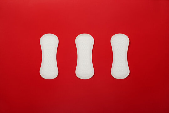 Hygienic sanitary pads on a red background