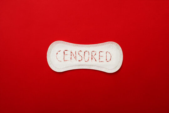 Hygienic pad with written word censored on red background