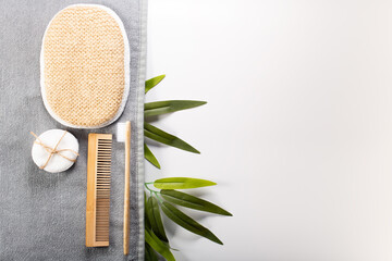 Zero waste, sustainable bathroom and lifestyle. Bamboo toothbrush, loofah sponge, cotton pads over white background