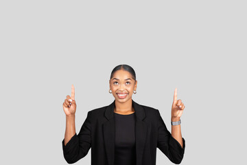 Optimistic African American businesswoman in a sleek black blazer smiling